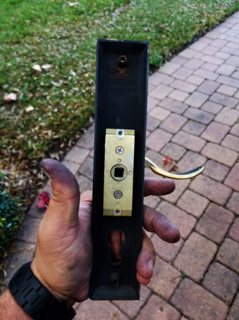 Replacement of a return spring for a multi-point locking Hurricane door